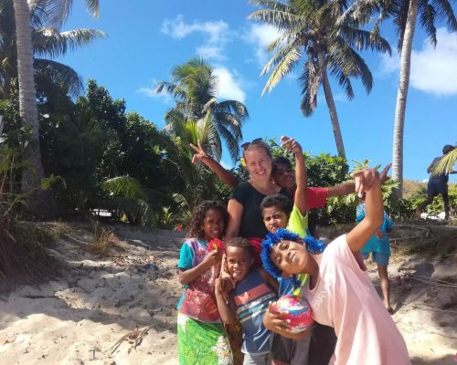 Noora-on-the-beach-in-Fiji-with-the-children-min-1