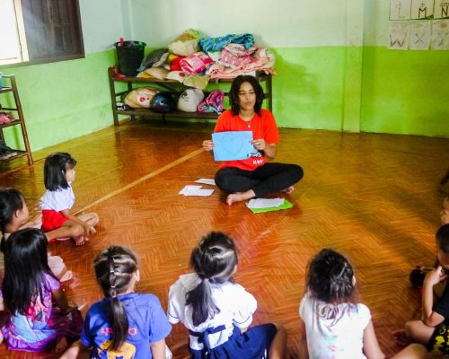 Participant teaching basic words in English to kids