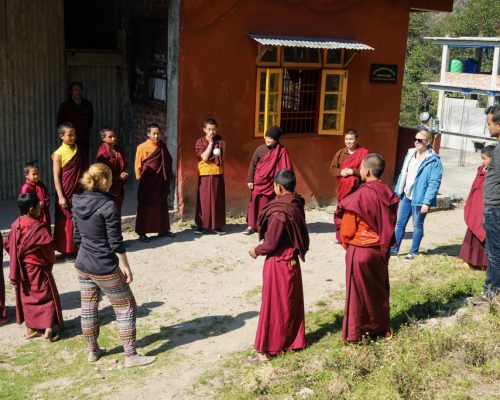 standing in a circle with the monks