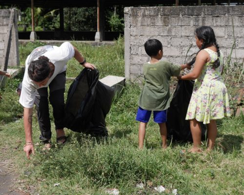 children cleaning rubbish