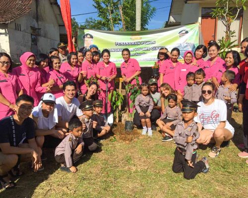 tree planting group pic with kids